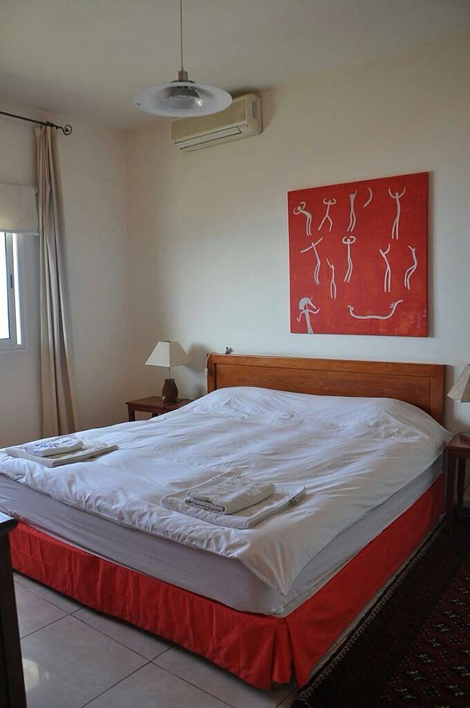 Double bedroom with fresh linen and a balcony window